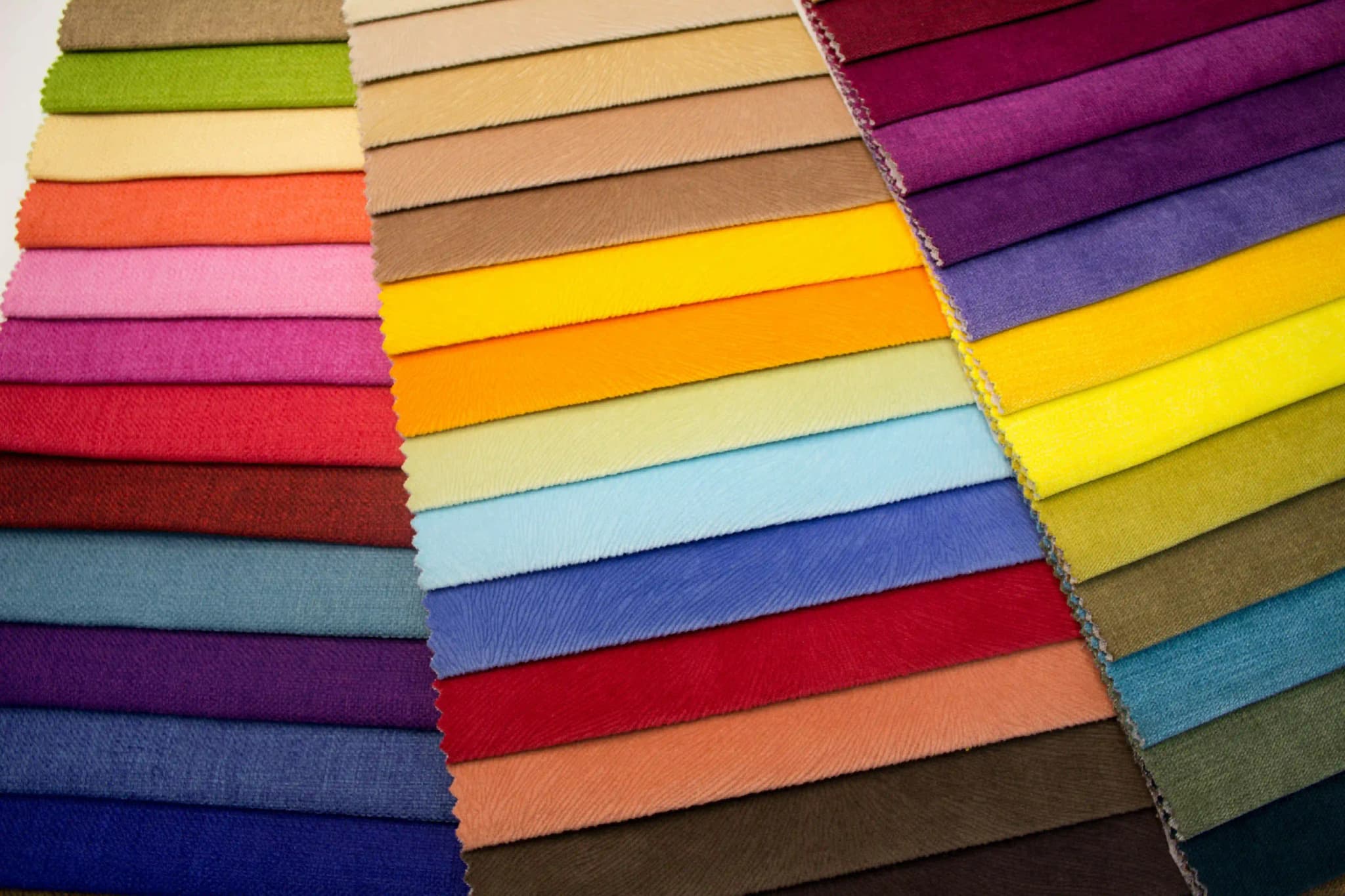 Various fabric samples and curtain designs